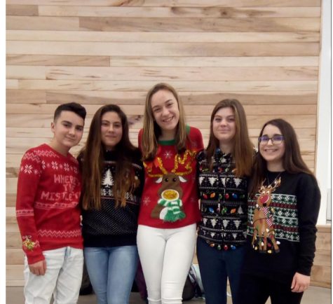 A group of students pose for a picture on Ugly Sweater Day, one of Greylocks most well-known school spirit days.