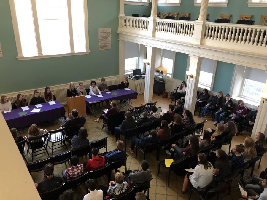 Two teams of eighth graders present speeches at Griffin Hall.