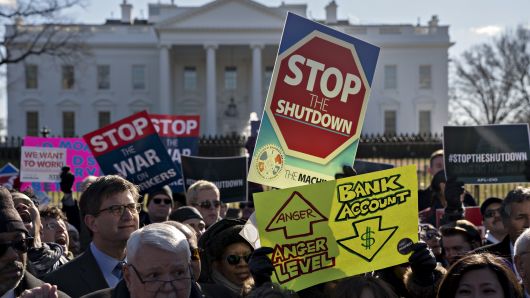 Demonstrators protest the federal government shutdown.