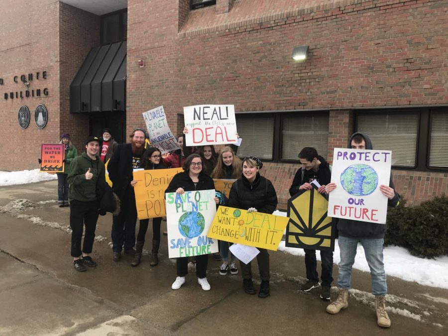 Greylock students hold signs outside of Richard Neals Pittsfield office.