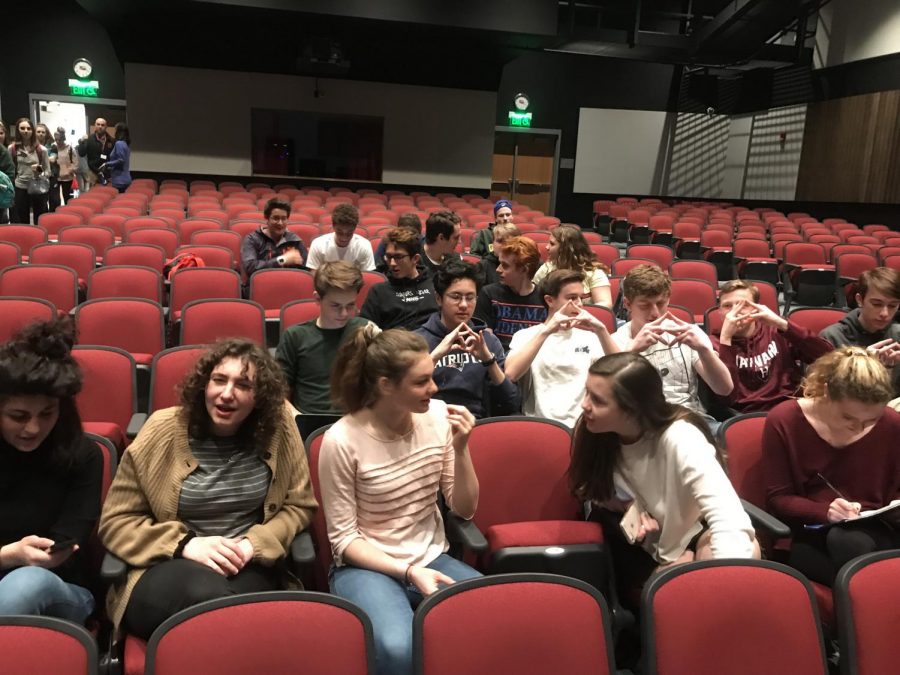 Students sit in the auditorium before Rhie's talk on Friday