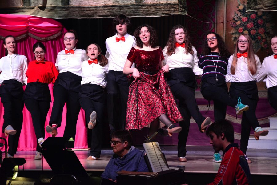 Weaver and ensemble members sing and dance in Hello, Dolly!