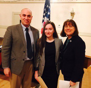 Wilson stands with vice principal Jake Schutz and State Representative Tricia Farley-Bouvier.